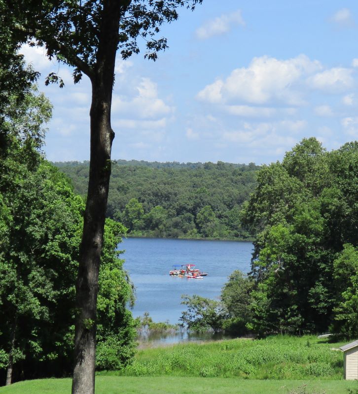 Boat in the cove below houses